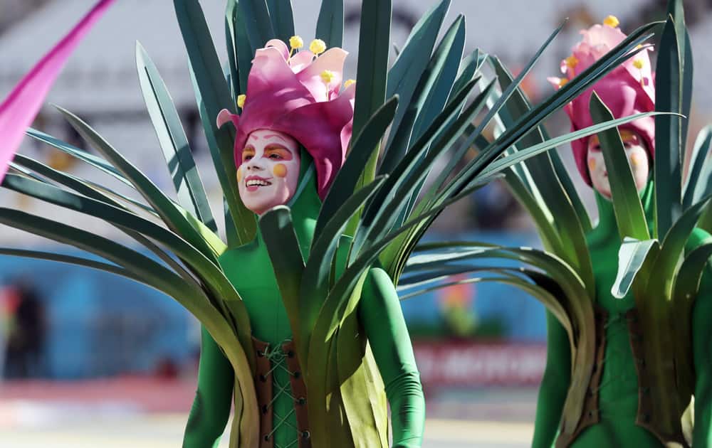 Actors perform during the opening ceremony before the group A World Cup soccer match between Brazil and Croatia, the opening game of the tournament, in the Itaquerao Stadium in Sao Paulo, Brazil.