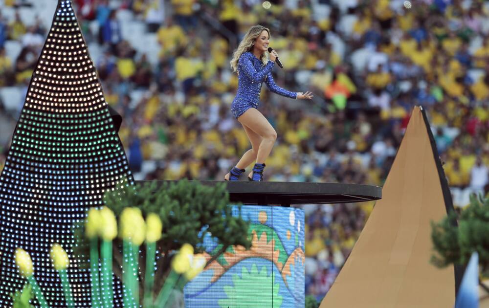 Brazilian singer Claudia Leitte performs during the opening ceremony before the group A World Cup soccer match between Brazil and Croatia, the opening game of the tournament, in the Itaquerao Stadium in Sao Paulo, Brazil.