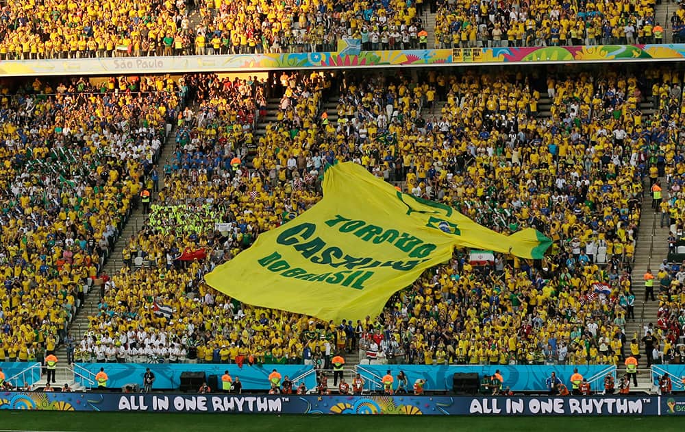 A giant shirt 'Castilho do Brasil Fan Club' is displayed during the group A World Cup soccer match between Brazil and Croatia, the opening game of the tournament, in the Itaquerao Stadium in Sao Paulo, Brazil.