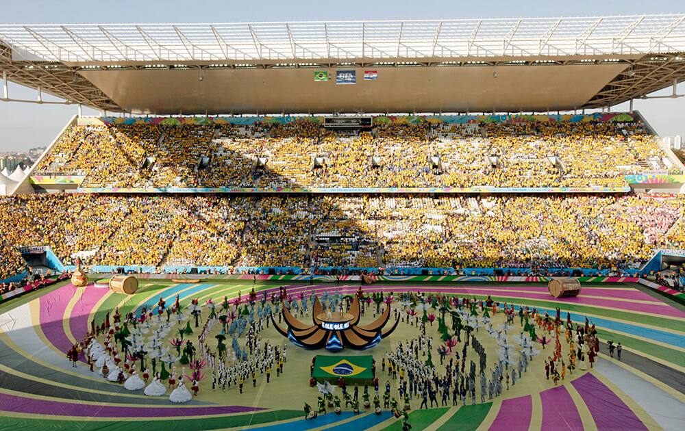 Actors perform during the opening ceremony ahead of the group A World Cup soccer match between Brazil and Croatia, the opening game of the tournament, in the Itaquerao Stadium in Sao Paulo, Brazil.