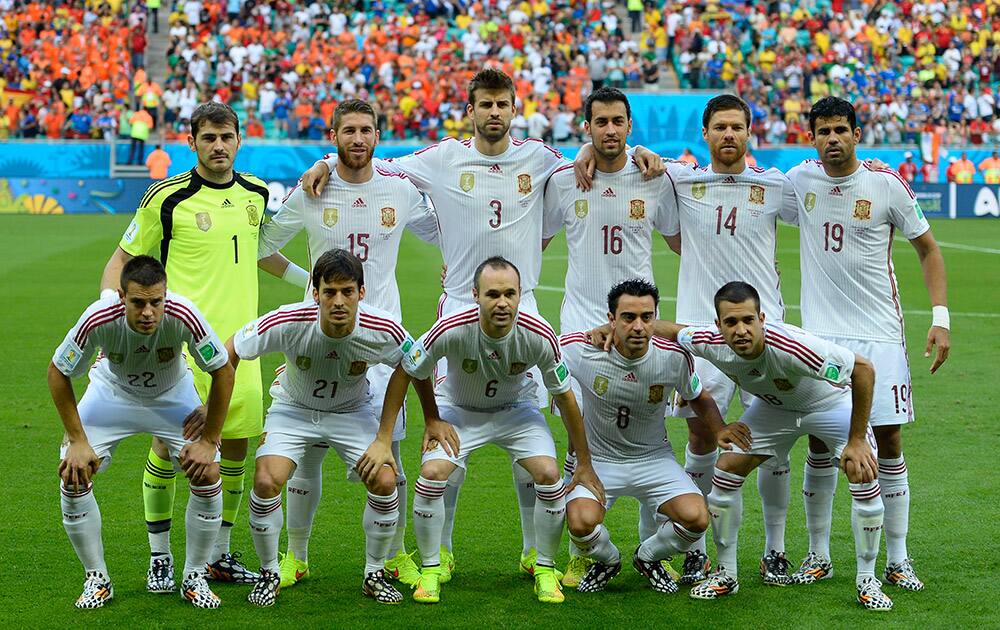 The Spanish team pose for a photo before the group B World Cup soccer match between Spain and the Netherlands at the Arena Ponte Nova in Salvador, Brazil.