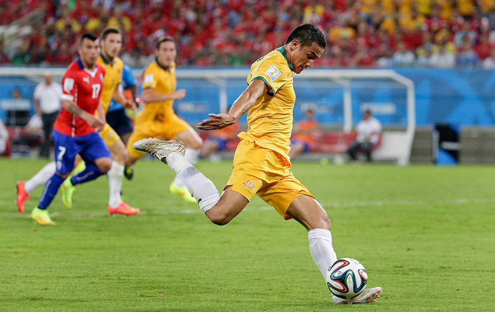 Australia's Tim Cahill takes a shot on goal during the group B World Cup soccer match between Chile and Australia in the Arena Pantanal in Cuiaba, Brazil.