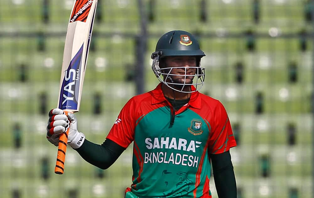 Bangladesh's Shakib Al Hasan acknowledges the crowd after scoring fifty runs during their first one-day International cricket match against India in Dhaka.