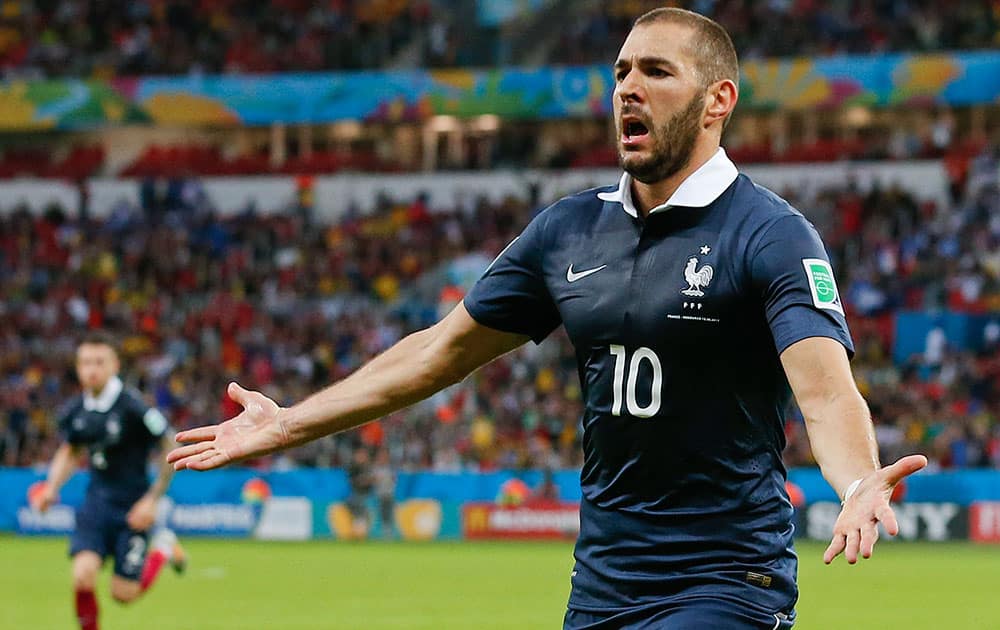 France's Karim Benzema celebrates after scoring his side's third goal during the group E World Cup soccer match between France and Honduras at the Estadio Beira-Rio in Porto Alegre, Brazil.