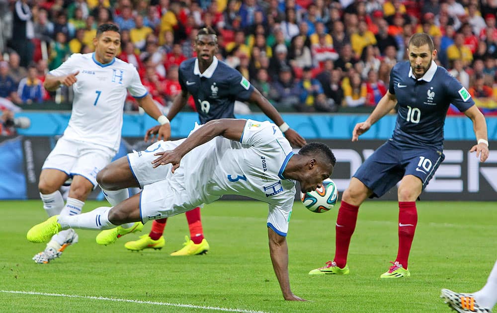 Honduras' Maynor Figueroa (3) tries to block the ball during the group E World Cup soccer match between France and Honduras at the Estadio Beira-Rio in Porto Alegre, Brazil.