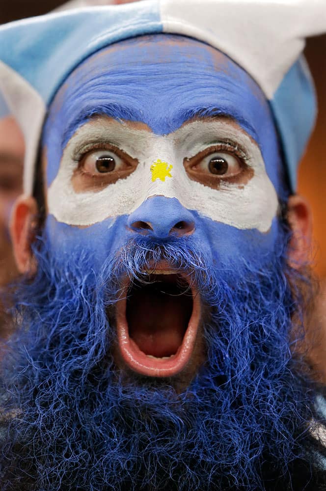 An Argentine supporter yells during the group F World Cup soccer match between Argentina and Bosnia at the Maracana Stadium in Rio de Janeiro, Brazil.