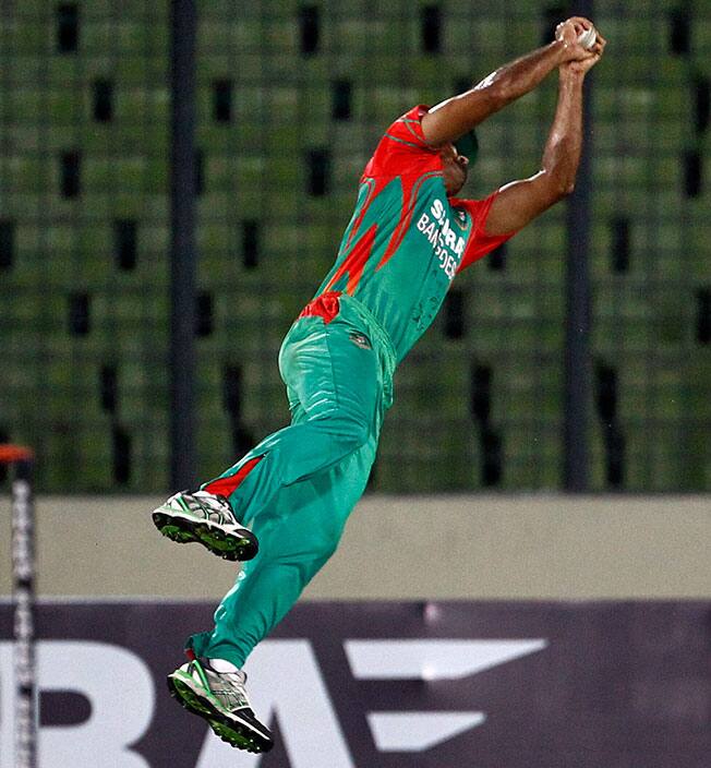 Bangladesh's Ziaur Rahman takes a catch successfully to dismiss India's Ajinkya Rahane during their first one-day International cricket match against India in Dhaka, Bangladesh.