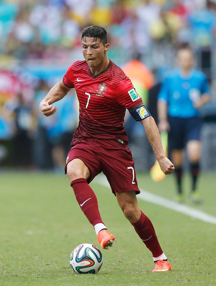 Portugal's Cristiano Ronaldo performs a step over during the group G World Cup soccer match between Germany and Portugal at the Arena Fonte Nova in Salvador, Brazil.