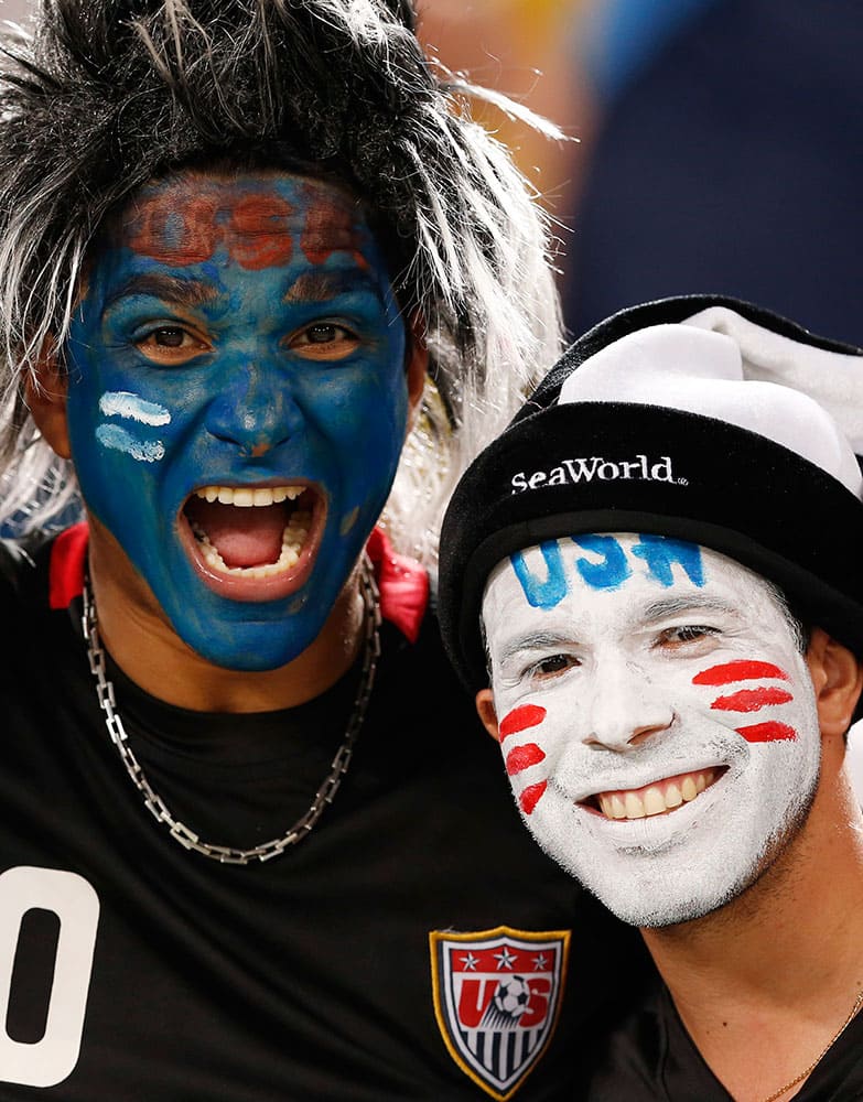 USA fans cheer before the group G World Cup soccer match between Ghana and the United States at the Arena das Dunas in Natal, Brazil.