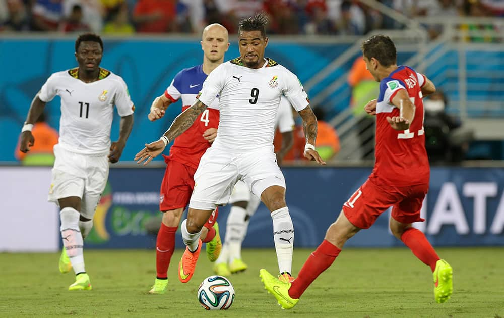 Ghana's Kevin-Prince Boateng runs with the ball during the group G World Cup soccer match between Ghana and the United States at the Arena das Dunas in Natal, Brazil.