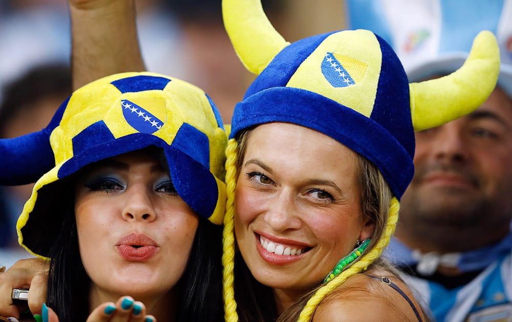 Fans pose before the start of the group F World Cup soccer match between Argentina and Bosnia at the Maracana Stadium in Rio de Janeiro, Brazil.