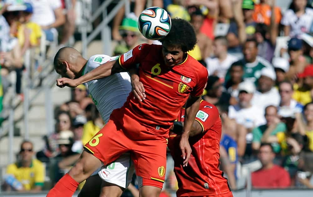 Belgium's Axel Witsel wins a header during the group H World Cup soccer match between Belgium and Algeria at the Mineirao Stadium in Belo Horizonte, Brazil.