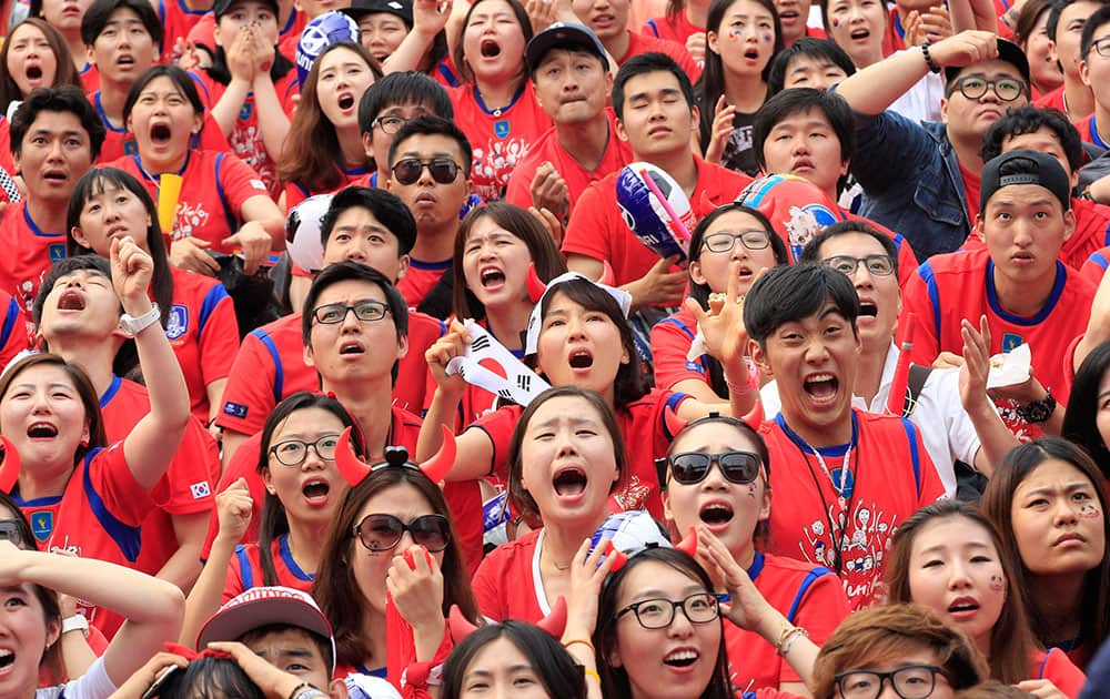 South Korean soccer fans react after Russian soccer team scored a goal against South Korea during the group H World Cup soccer match between Russia and South Korea, at a public viewing venue in Seoul, South Korea.