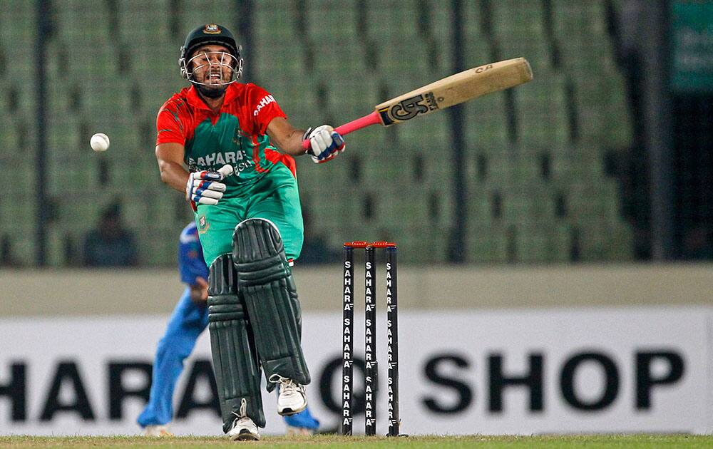 Bangladesh's Mithun Ali reacts after missing a ball during their second one-day International cricket match against India in Dhaka, Bangladesh.