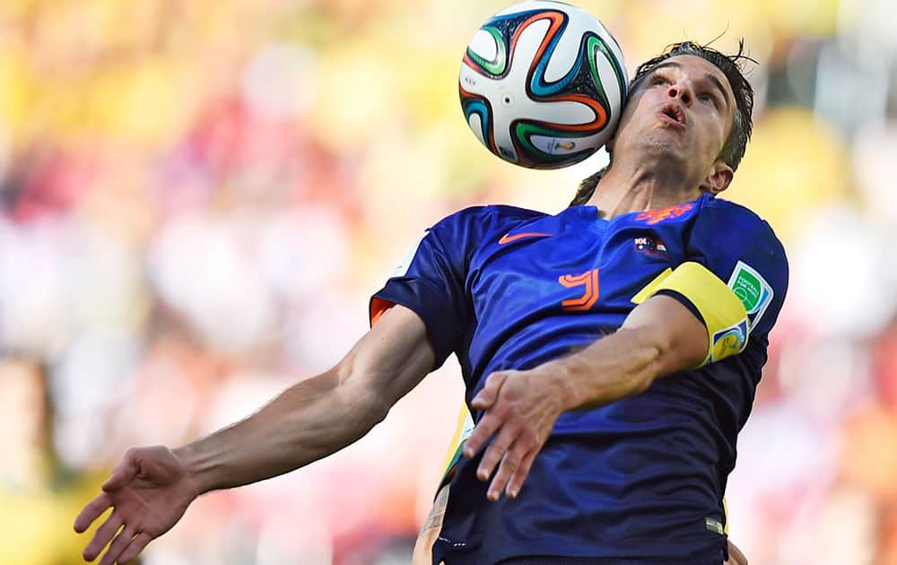 Netherlands' Robin van Persie controls the ball during the group B World Cup soccer match between Australia and the Netherlands at the Estadio Beira-Rio in Porto Alegre, Brazil.