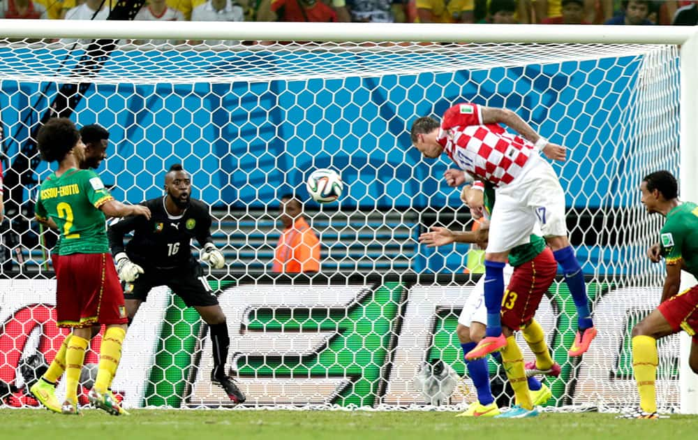 Croatia's Mario Mandzukic, second right, scores his side's third goal during the group A World Cup soccer match between Cameroon and Croatia at the Arena da Amazonia in Manaus, Brazil.