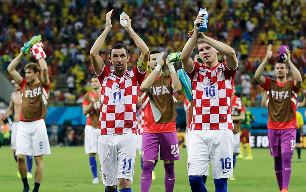 Croatian players applaud their supporters following their 4-0 victory over Cameroon during the group A World Cup soccer match between Cameroon and Croatia at the Arena da Amazonia in Manaus, Brazil.