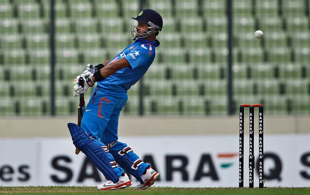 India's Manoj Tiwary avoids a bouncer during their third one-day International cricket match against Bangladesh in Dhaka.