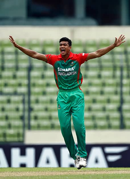 Bangladesh's Taskin Ahmed unsuccessfully makes an LBW appeal during their third one-day International cricket match against India in Dhaka.