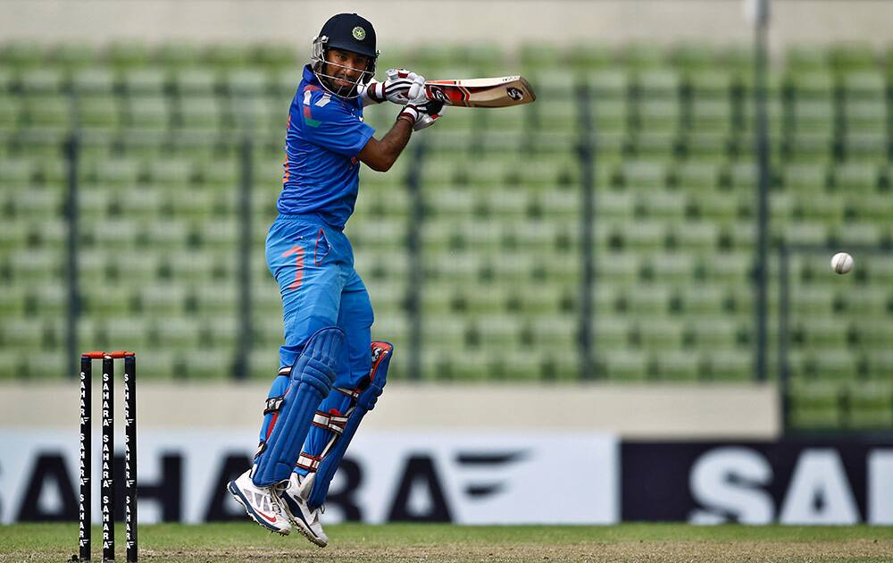 Cheteshwar Pujara plays a shot during their third one-day International cricket match against Bangladesh in Dhaka, Bangladesh.