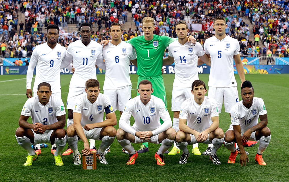 The England team pose for a group photo before the group D World Cup soccer match between Uruguay and England at the Itaquerao Stadium in Sao Paulo, Brazil.