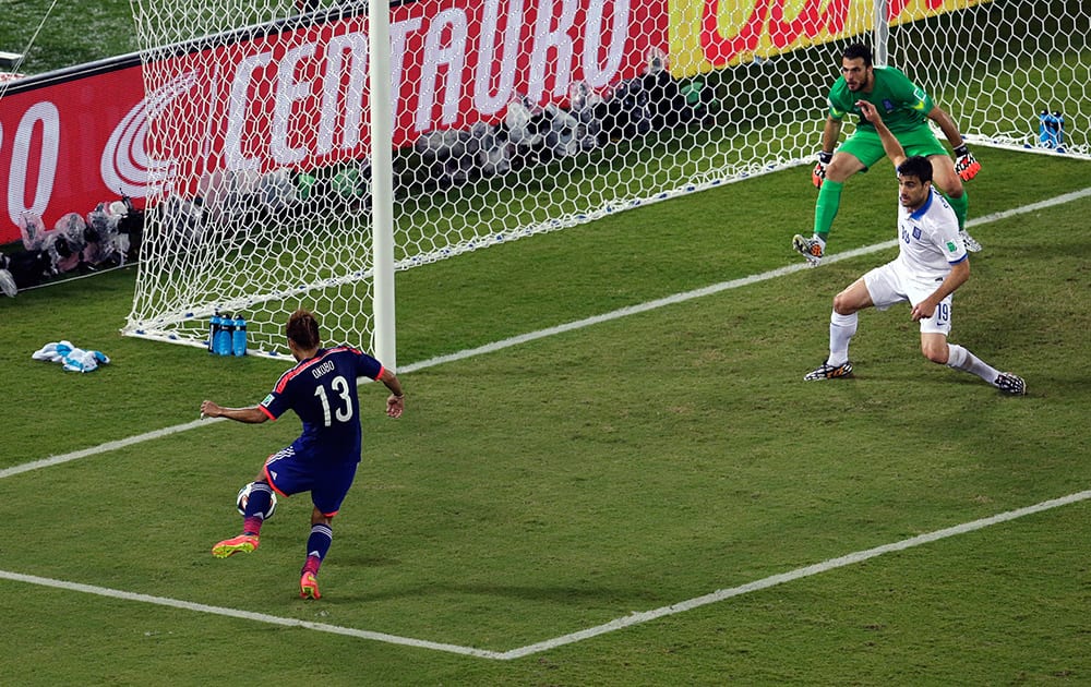 Japan's Yoshito Okubo fails to score during the group C World Cup soccer match between Japan and Greece at the Arena das Dunas in Natal, Brazil.