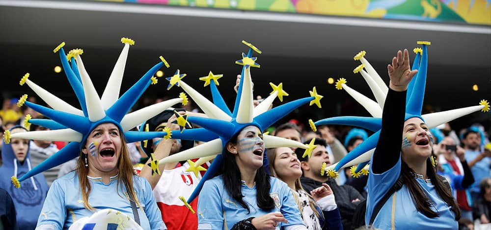 Uruguayan supporters react before the start of the group D World Cup soccer match between Uruguay and England at the Itaquerao Stadium in Sao Paulo, Brazil.