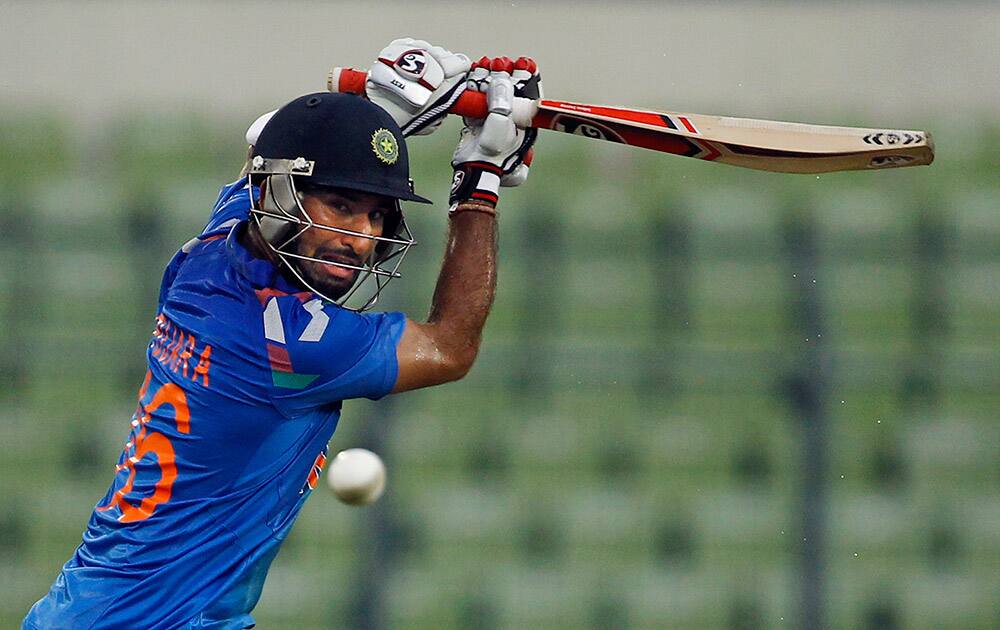 India's Cheteshwar Pujara plays a shot during the third one-day International cricket match against Bangladesh in Dhaka.