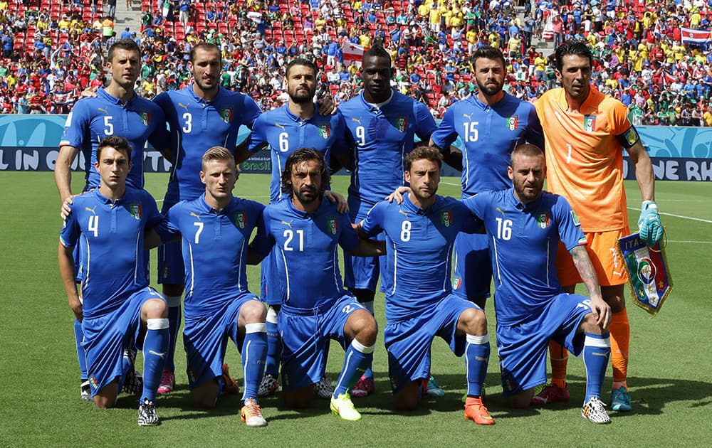 The Italian team pose for a group photos before the group D World Cup soccer match between Italy and Costa Rica at the Arena Pernambuco in Recife, Brazil.