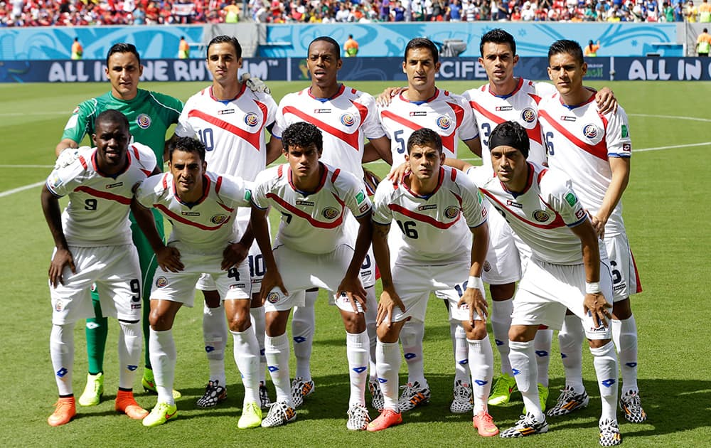 The Costa Rica team poses for a photo before the group D World Cup soccer match between Italy and Costa Rica at the Arena Pernambuco in Recife, Brazil.