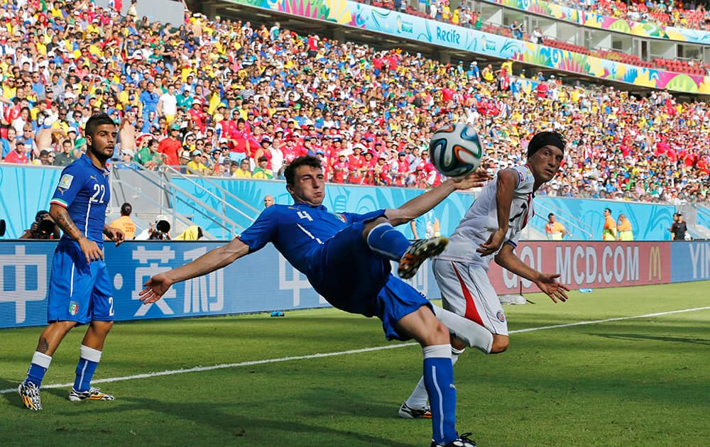 Italy's Matteo Darmian clear the ball during the group D World Cup soccer match between Italy and Costa Rica at the Arena Pernambuco in Recife, Brazil.