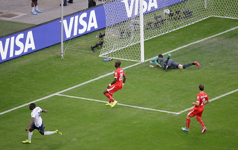 France's Blaise Matuidi, left, scores his side's second goal past Switzerland's goalkeeper Diego Benaglio, top, during the group E World Cup soccer match between Switzerland and France at the Arena Fonte Nova in Salvador, Brazil.