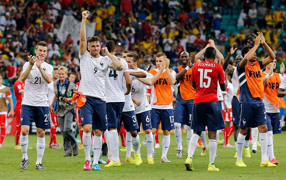 French players celebrate after the group E World Cup soccer match between Switzerland and France at the Arena Fonte Nova in Salvador, Brazil.