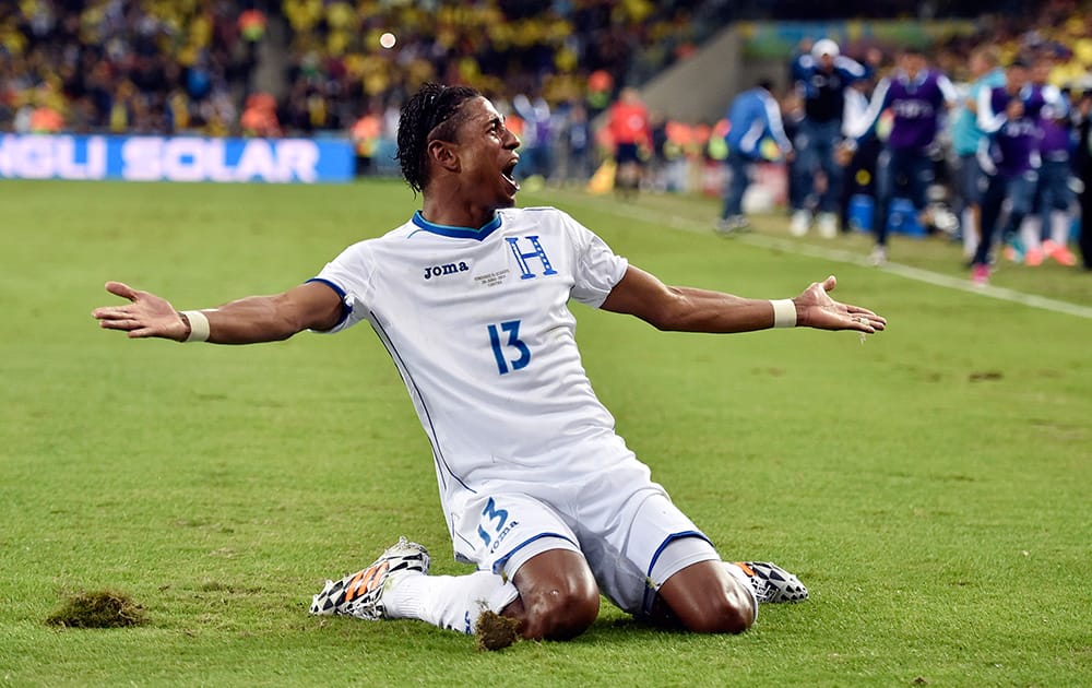 Honduras' Carlo Costly celebrates after scoring a goal during the group E World Cup soccer match between Honduras and Ecuador at the Arena da Baixada in Curitiba.