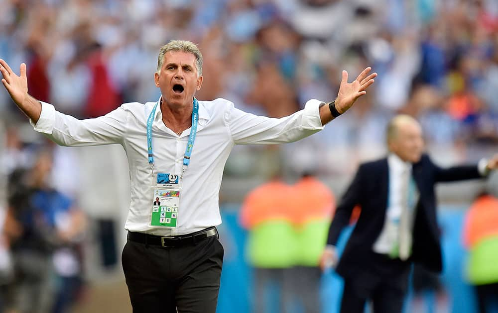 Iran's head coach Carlos Queiroz questions a call during the group F World Cup soccer match between Argentina and Iran at the Mineirao Stadium in Belo Horizonte, Brazil.