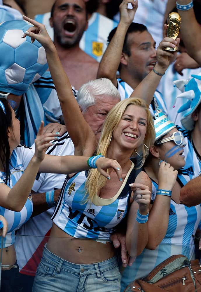 Argentina supporters celebrate after the group F World Cup soccer match between Argentina and Iran at the Mineirao Stadium in Belo Horizonte, Brazil.