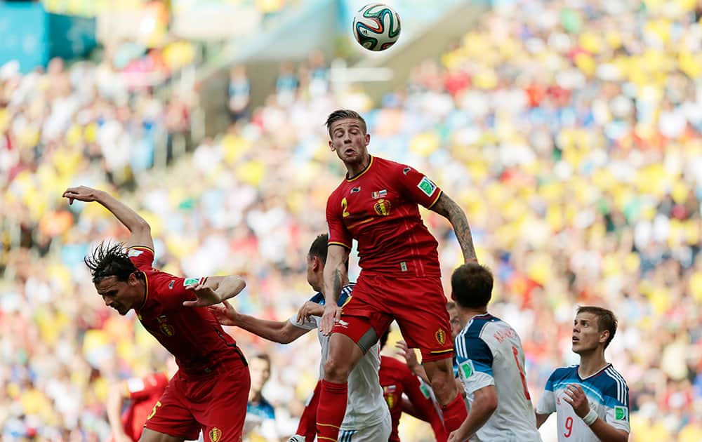 Belgium's Toby Alderweireld, centre, heads the ball during the group H World Cup soccer match between Belgium and Russia at the Maracana stadium in Rio de Janeiro, Brazil.