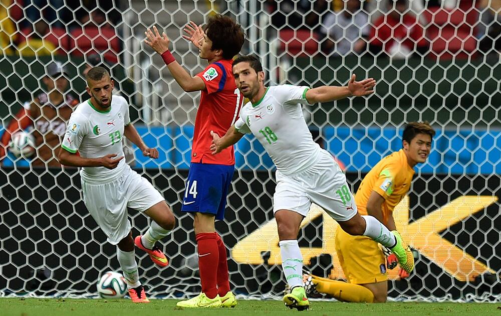 Algeria's Abdelmoumene Djabou celebrates after scoring his side's third goal during the group H World Cup soccer match between South Korea and Algeria at the Estadio Beira-Rio in Porto Alegre, Brazil.