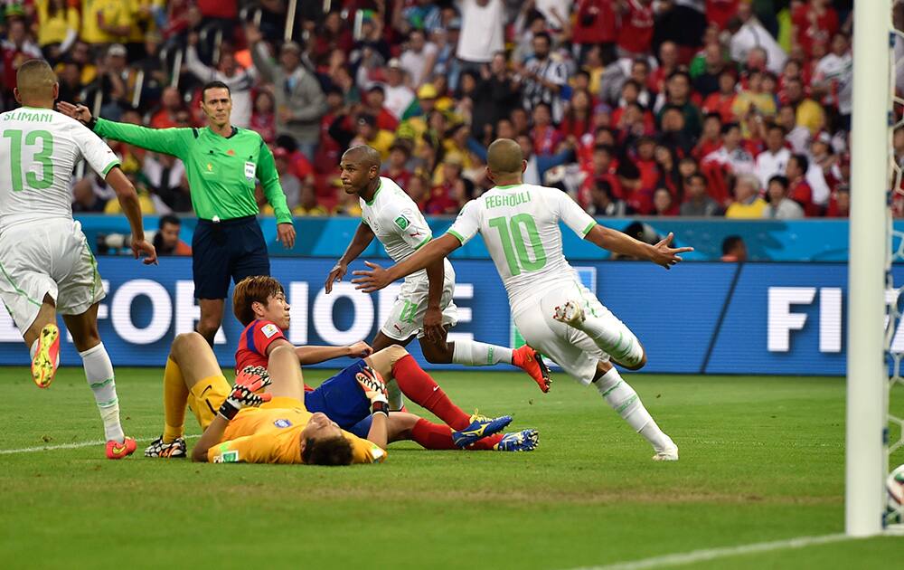 Algeria's Yacine Brahimi celebrates after scoring his side's fourth goal during the group H World Cup soccer match between South Korea and Algeria at the Estadio Beira-Rio in Porto Alegre, Brazil.