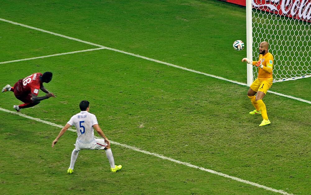 Portugal's Silvestre Varela scores his side's second goal past United States' goalkeeper Tim Howard during the group G World Cup soccer match between the USA and Portugal at the Arena da Amazonia in Manaus, Brazil.