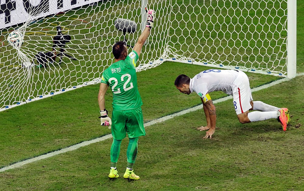 United States' Clint Dempsey scores his side's second goal during the group G World Cup soccer match between the USA and Portugal at the Arena da Amazonia in Manaus, Brazil.