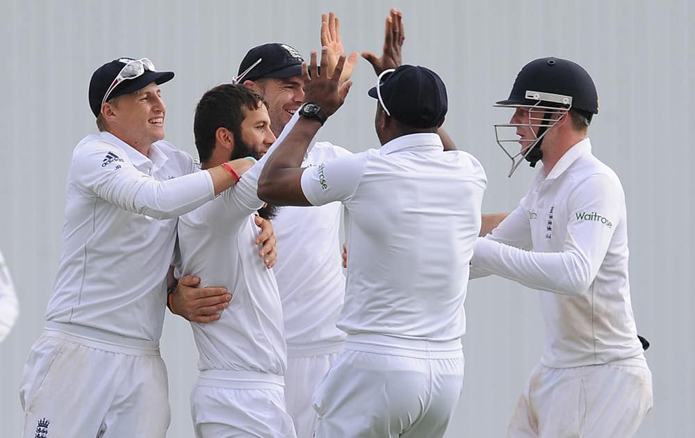 England's Moeen Ali celebrates with team mates after bowling Sri Lanka's Lahiru Thirimanne for a duck, during day three of the Second Test Match between England and Sri Lanka at Headingley cricket ground, Leeds, England.