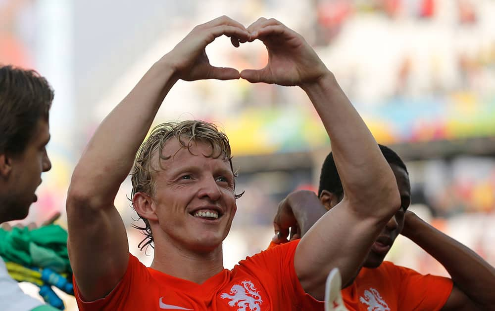 Netherlands' Dirk Kuyt forms a heart with his hands after the group B World Cup soccer match between the Netherlands and Chile at the Itaquerao Stadium in Sao Paulo, Brazil.