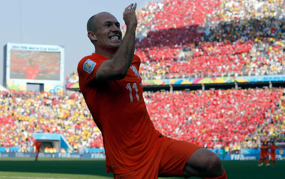 Netherlands' Arjen Robben after his teammate Memphis Depay scored their second goal during the group B World Cup soccer match between the Netherlands and Chile at the Itaquerao Stadium in Sao Paulo, Brazil.