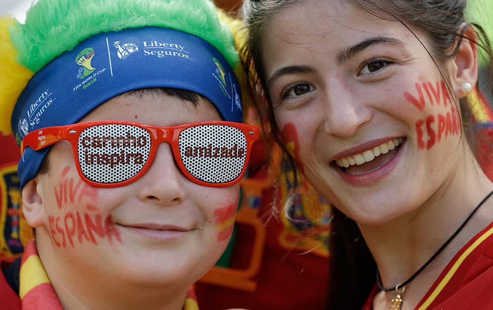 Spain's fans wait for the start of the group B World Cup soccer match between Australia and Spain at the Arena da Baixada in Curitiba, Brazil.