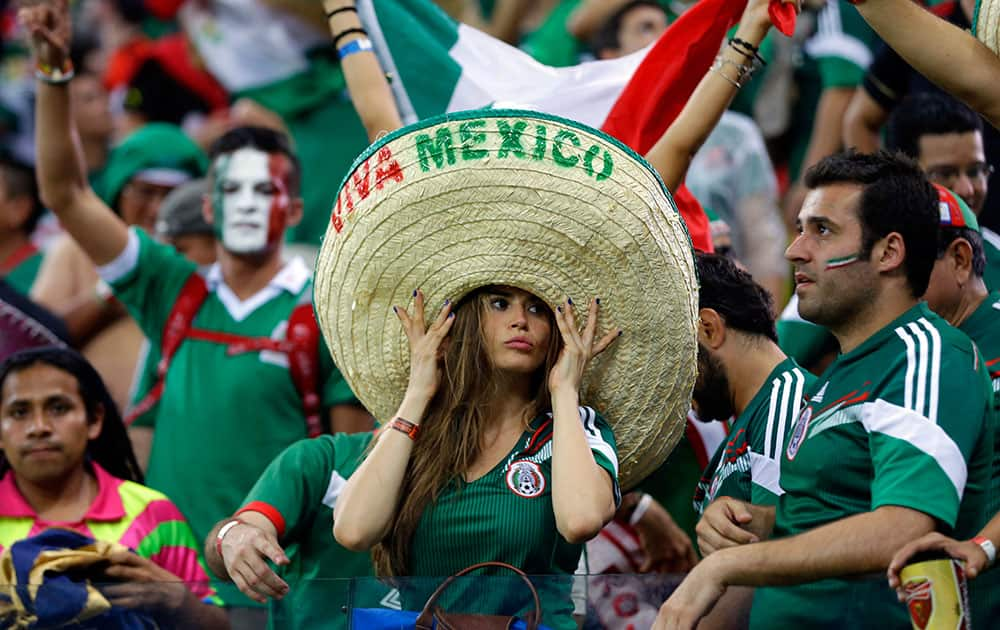 Mexico's fans celebrate after the group A World Cup soccer match between Croatia and Mexico at the Arena Pernambuco in Recife, Brazil.