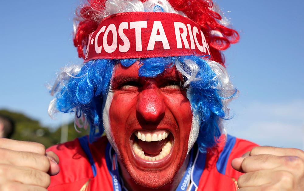 A supporter celebrates Costa Rica's classification at the end of the World Cup group D match against England, at the Mineirao Stadium, in Belo Horizonte, Brazil.