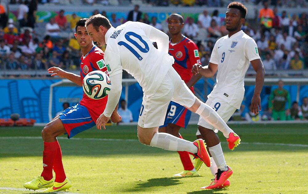 England's Wayne Rooney attempts to connect with a cross during the group D World Cup soccer match between Costa Rica and England at the Mineirao Stadium in Belo Horizonte, Brazil.