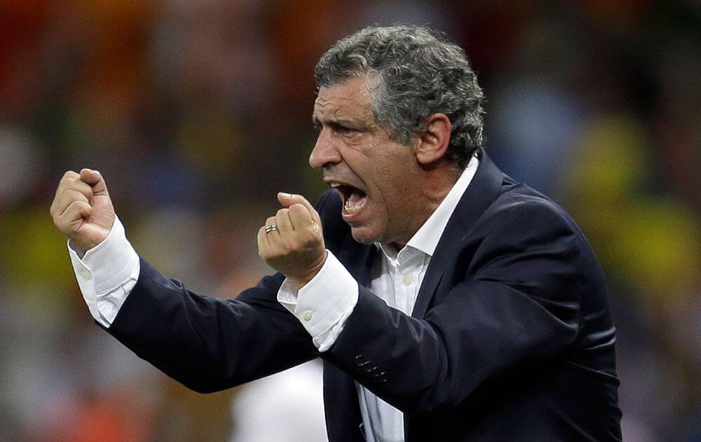 Greece's head coach Fernando Santos instructs his players during the group C World Cup soccer match between Greece and Ivory Coast at the Arena Castelao in Fortaleza, Brazil.