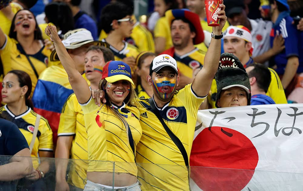 Colombia's fans celebrate after the group C World Cup soccer match between Japan and Colombia at the Arena Pantanal in Cuiaba, Brazil.